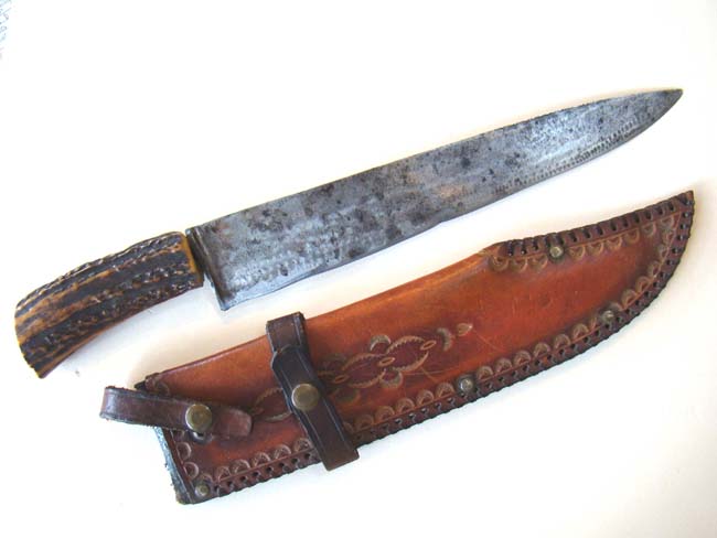 A stag horn handled hunting knife with its' original leather sheath